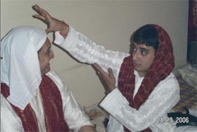 The Bride's Brother Puts On The Tilak On The Groom's Forehead