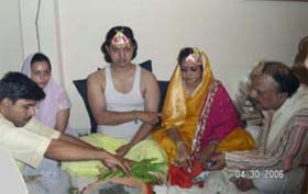 A bihari haldi attire.the groom though should be wearing an angocha instead of the vest as worn by his father here