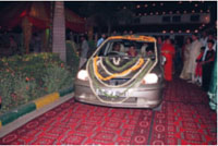 car for vidai.(note the'sindhora' in the bride's hand)